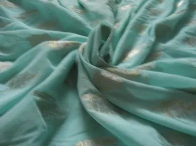 Polyester georgette fabric with metalic silver & gold jacquard~Sea Green colour